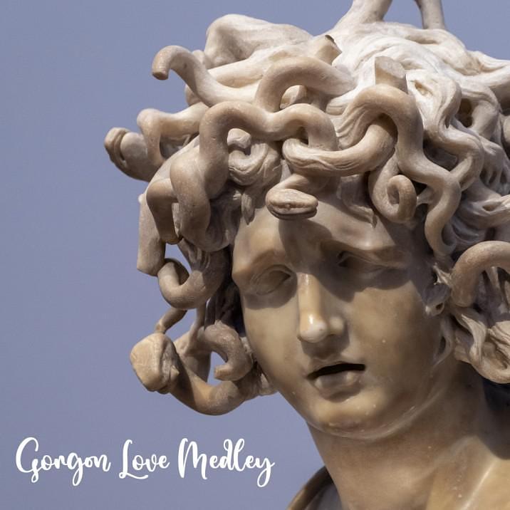 A photo of a white marble medusa statue on a blue background, with the title “Gorgon Love Medley”